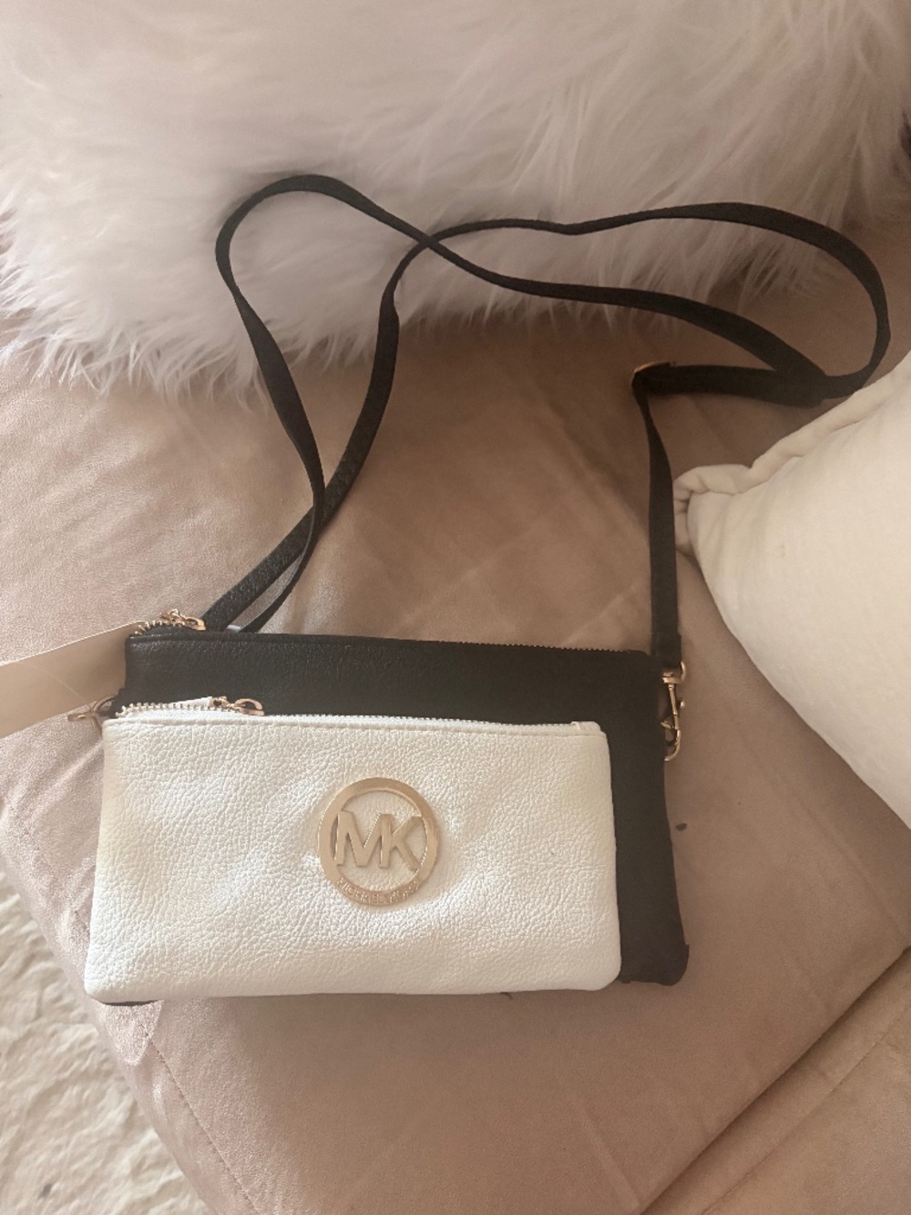 Black and white Michael Kors multi-compartment crossbody bag